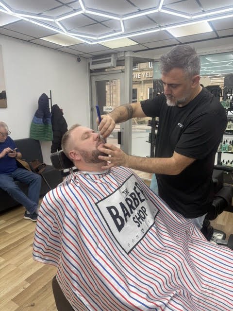 Traditional cut-throat razor shave in progress at MK’S